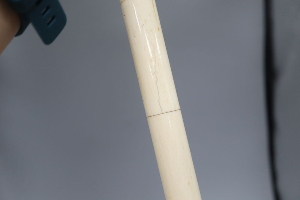 An Indian bone walking cane, with dog handle, c.1960, length 92cm